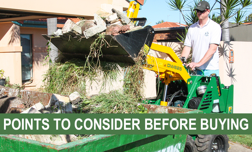 Kanga loader tipping rubble into a skip